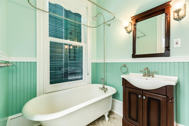 1428 Ball, Galveston, TX 77550 - full bath with a wainscoted wall, a freestanding tub, and vanity