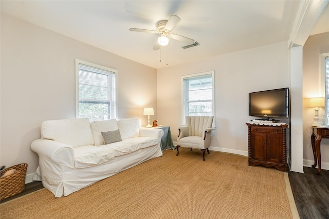 1428 Ball, Galveston, TX 77550 - living area featuring healthy amount of natural light, ceiling fan, wood finished floors, and baseboards