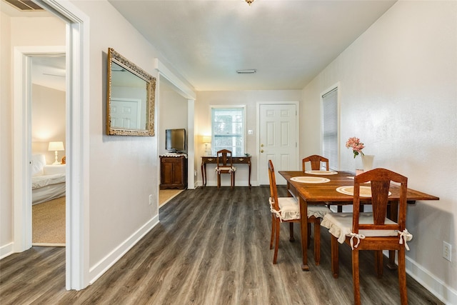 1428 Ball, Galveston, TX 77550 - dining space featuring dark wood-style flooring and baseboards