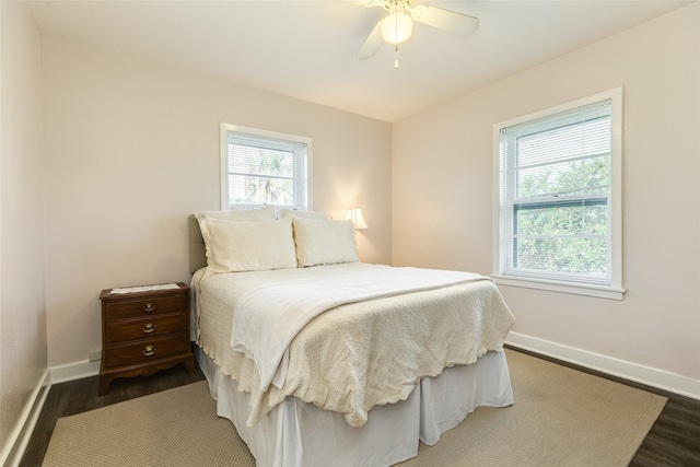 1428 Ball, Galveston, TX 77550 - bedroom featuring dark wood finished floors, baseboards, and ceiling fan