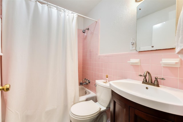 1428 Ball, Galveston, TX 77550 - bathroom featuring toilet, shower / tub combo with curtain, vanity, and tile walls