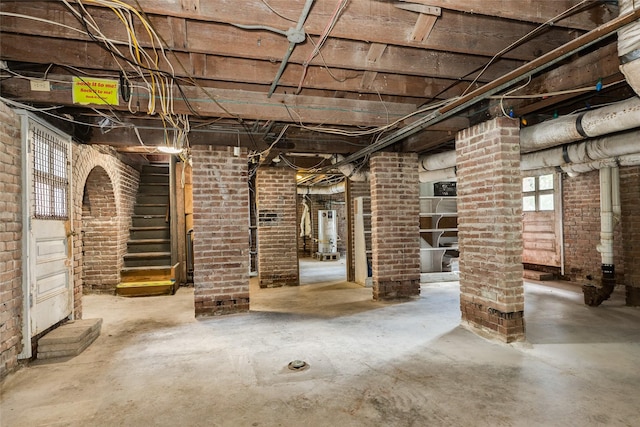 1428 Ball, Galveston, TX 77550 - below grade area featuring gas water heater and brick wall