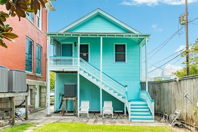 1428 Ball, Galveston, TX 77550 - back of house featuring stairway, cooling unit, fence, and a porch