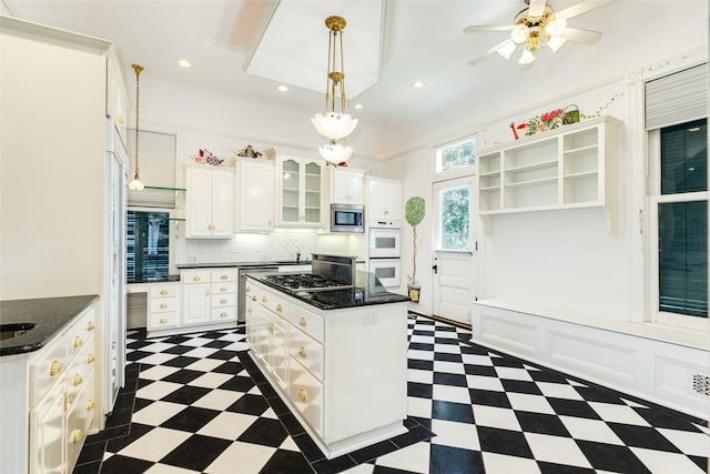 1428 Ball, Galveston, TX 77550 - kitchen with stainless steel appliances, open shelves, white cabinetry, dark flooring, and recessed lighting