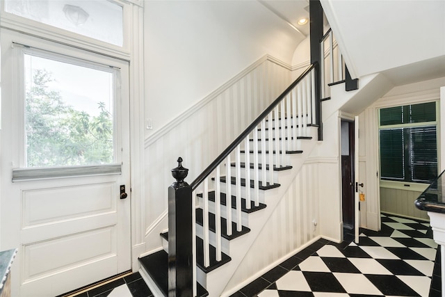 1428 Ball, Galveston, TX 77550 - stairs featuring a decorative wall, tile patterned floors, and wainscoting