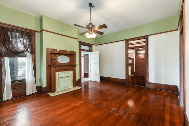 1428 Ball, Galveston, TX 77550 - unfurnished living room featuring a fireplace, wood finished floors, ceiling fan, and baseboards
