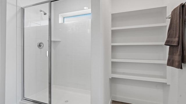 bathroom featuring an enclosed shower