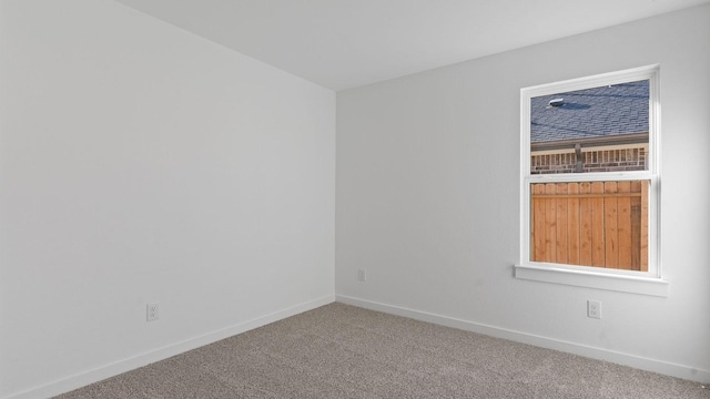 spare room featuring carpet floors