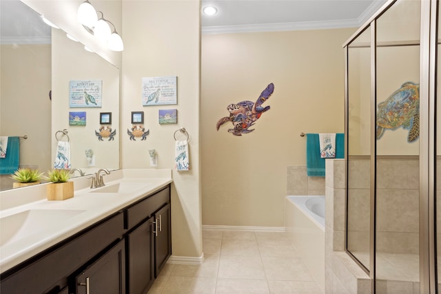 full bathroom with a sink, ornamental molding, a bath, tile patterned floors, and double vanity