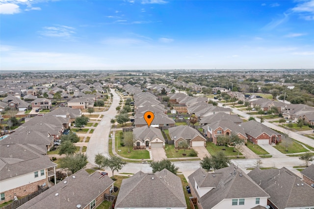 birds eye view of property with a residential view