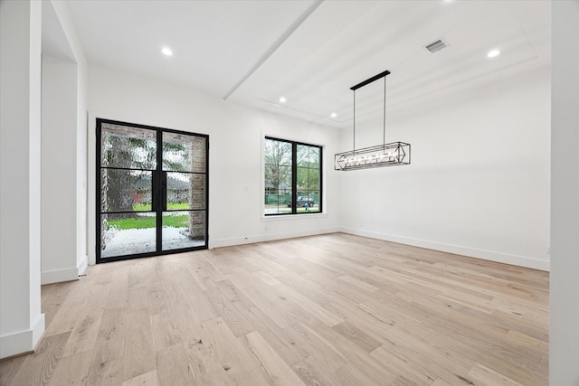 unfurnished room featuring light wood-type flooring