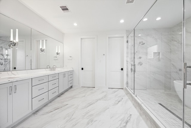 bathroom with vanity and a shower with door