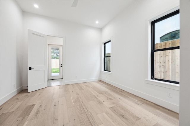 empty room with light hardwood / wood-style floors