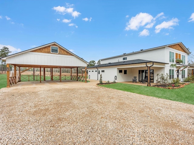 192 B Fm 1097, New Waverly, TX 77358 - back of house with dirt driveway and a carport