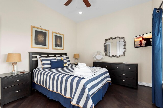 11446 Sea Butterfly, Galveston, TX 77554 - bedroom with dark wood-style flooring, baseboards, and ceiling fan