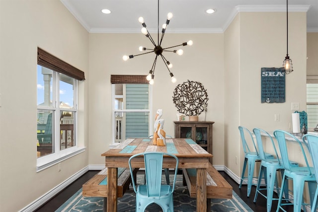 11446 Sea Butterfly, Galveston, TX 77554 - dining room featuring a chandelier, dark wood-style flooring, baseboards, crown molding, and recessed lighting