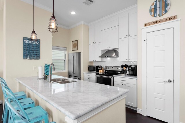 11446 Sea Butterfly, Galveston, TX 77554 - kitchen with appliances with stainless steel finishes, under cabinet range hood, a sink, white cabinets, and light stone counters