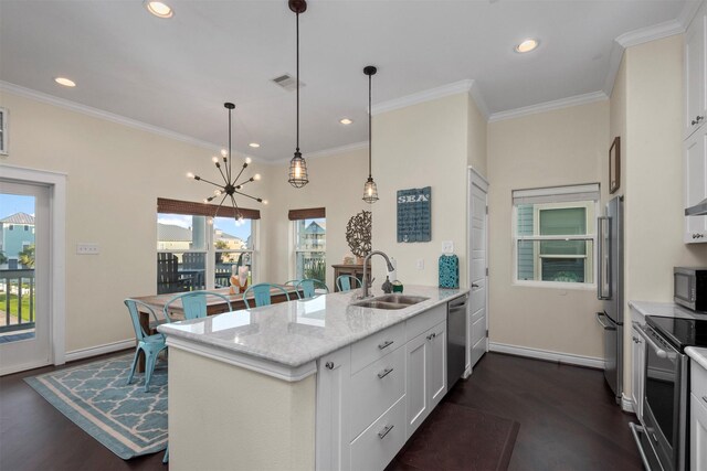11446 Sea Butterfly, Galveston, TX 77554 - kitchen with a sink, stainless steel appliances, a peninsula, dark wood-type flooring, and recessed lighting