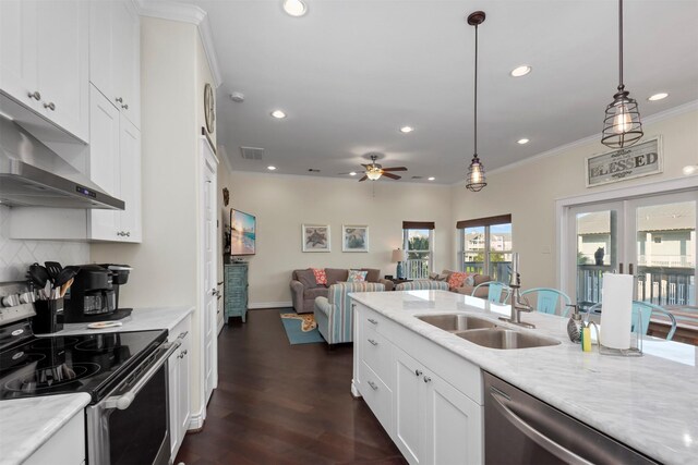 11446 Sea Butterfly, Galveston, TX 77554 - kitchen with appliances with stainless steel finishes, under cabinet range hood, a sink, recessed lighting, and a ceiling fan