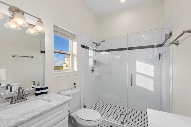 11446 Sea Butterfly, Galveston, TX 77554 - full bath with a shower stall, toilet, vanity, and recessed lighting
