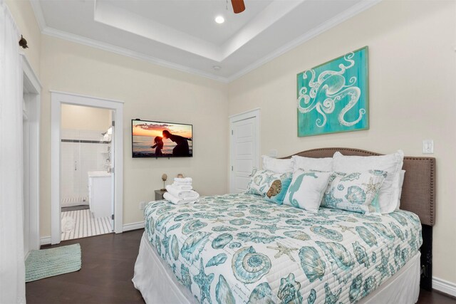 11446 Sea Butterfly, Galveston, TX 77554 - bedroom featuring wood finished floors, a tray ceiling, ornamental molding, a ceiling fan, and baseboards
