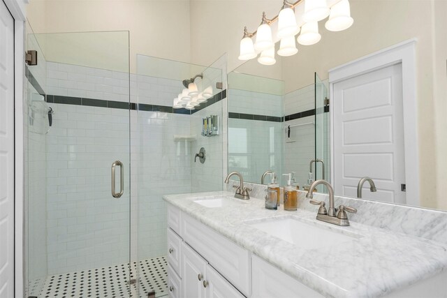 11446 Sea Butterfly, Galveston, TX 77554 - bathroom featuring a shower stall and double vanity