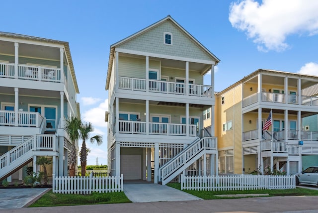 11446 Sea Butterfly, Galveston, TX 77554 - raised beach house with a garage, stairs, fence, and driveway