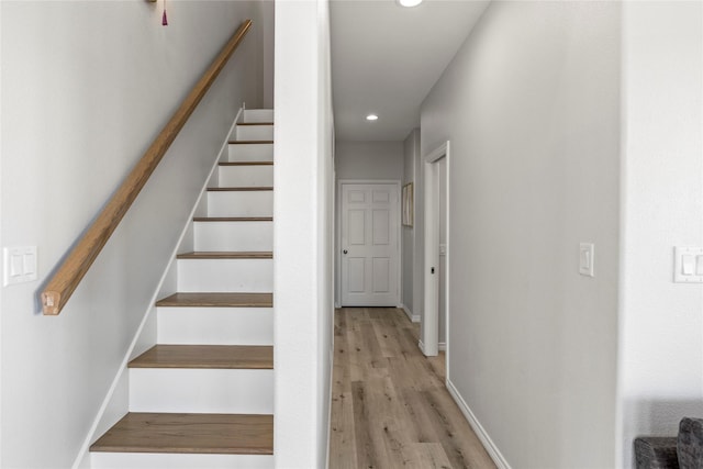 stairway featuring hardwood / wood-style floors