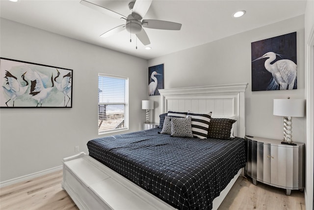 bedroom with ceiling fan and light wood-type flooring