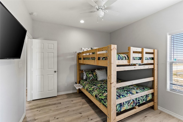 bedroom featuring light hardwood / wood-style flooring and ceiling fan