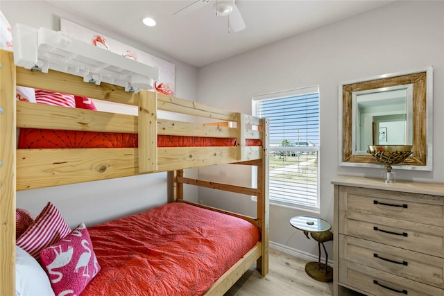 bedroom with ceiling fan and light hardwood / wood-style flooring