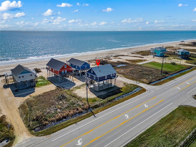 aerial view featuring a view of the beach and a water view