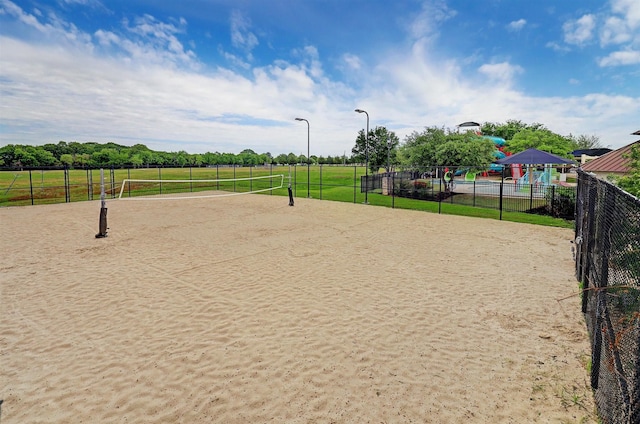 surrounding community featuring a rural view and volleyball court