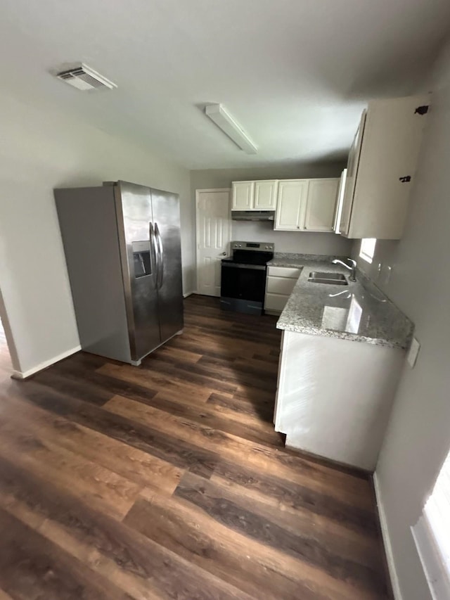 kitchen with dark hardwood / wood-style floors, white cabinetry, sink, light stone counters, and stainless steel appliances