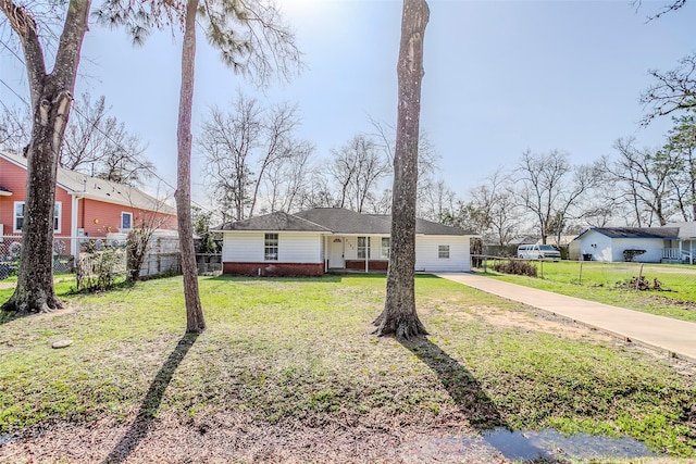 ranch-style home with a front yard