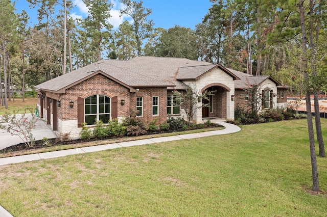 ranch-style house with a front lawn