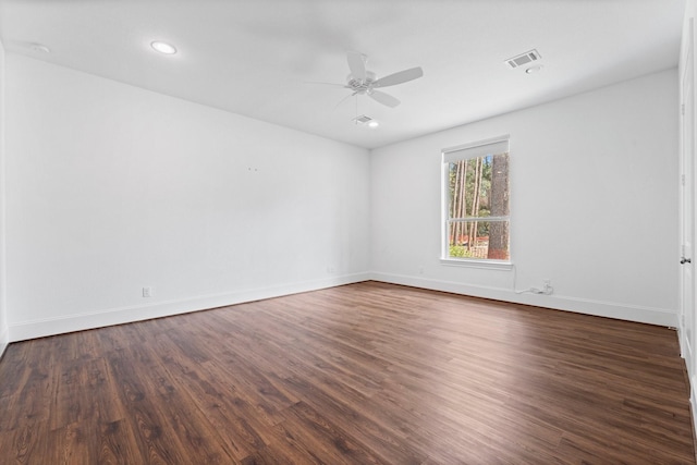 unfurnished room featuring dark hardwood / wood-style floors and ceiling fan