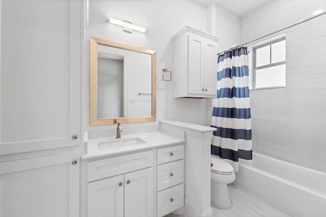 full bathroom with vanity, toilet, and shower / bath combo with shower curtain