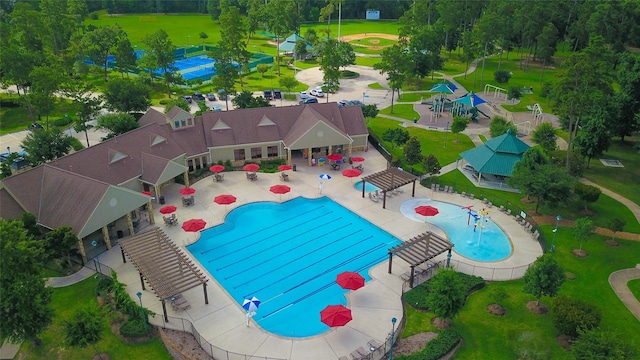 view of swimming pool with a pergola and a patio