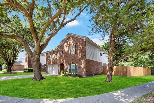 view of front of home featuring a garage, driveway, fence, a front lawn, and brick siding