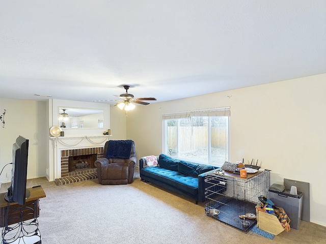 carpeted living room with a brick fireplace and a ceiling fan