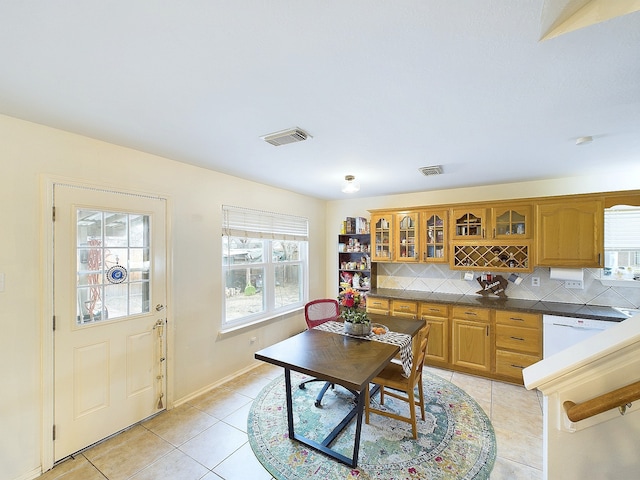 dining space featuring visible vents, baseboards, and light tile patterned floors