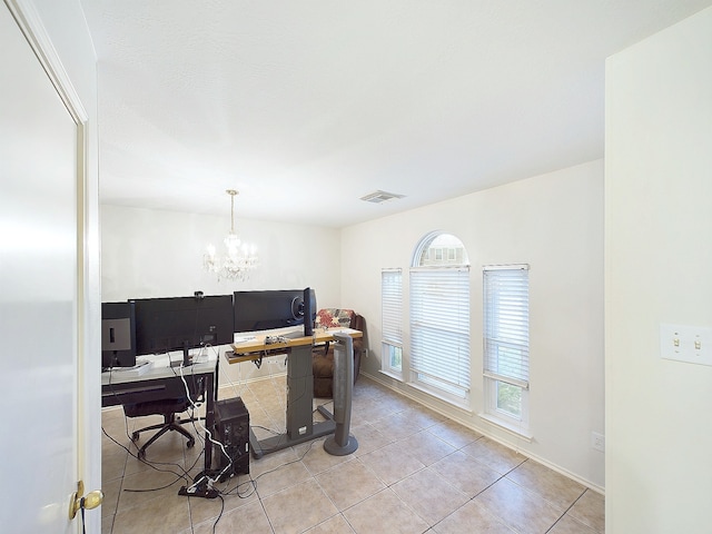 office space featuring visible vents, a notable chandelier, and light tile patterned floors