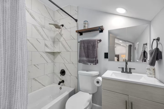 full bathroom with tiled shower / bath combo, vanity, vaulted ceiling, and toilet