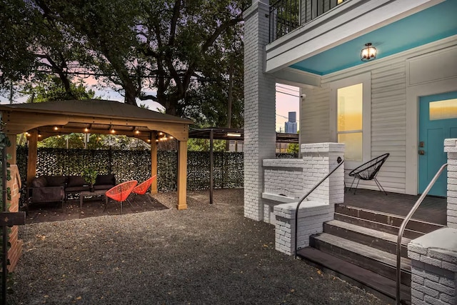 exterior space with a gazebo and an outdoor living space