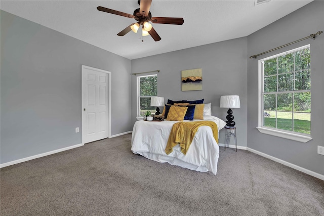 carpeted bedroom with ceiling fan