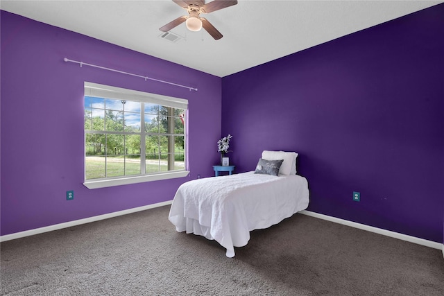 bedroom with ceiling fan and carpet floors