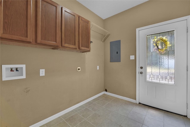 washroom with electric dryer hookup, hookup for a washing machine, electric panel, cabinets, and light tile patterned flooring