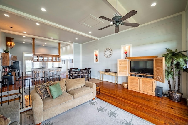 living room with hardwood / wood-style flooring and ceiling fan