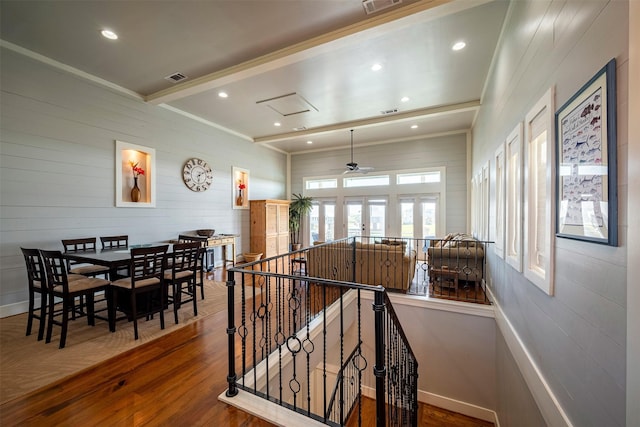 hall featuring beamed ceiling and wood-type flooring